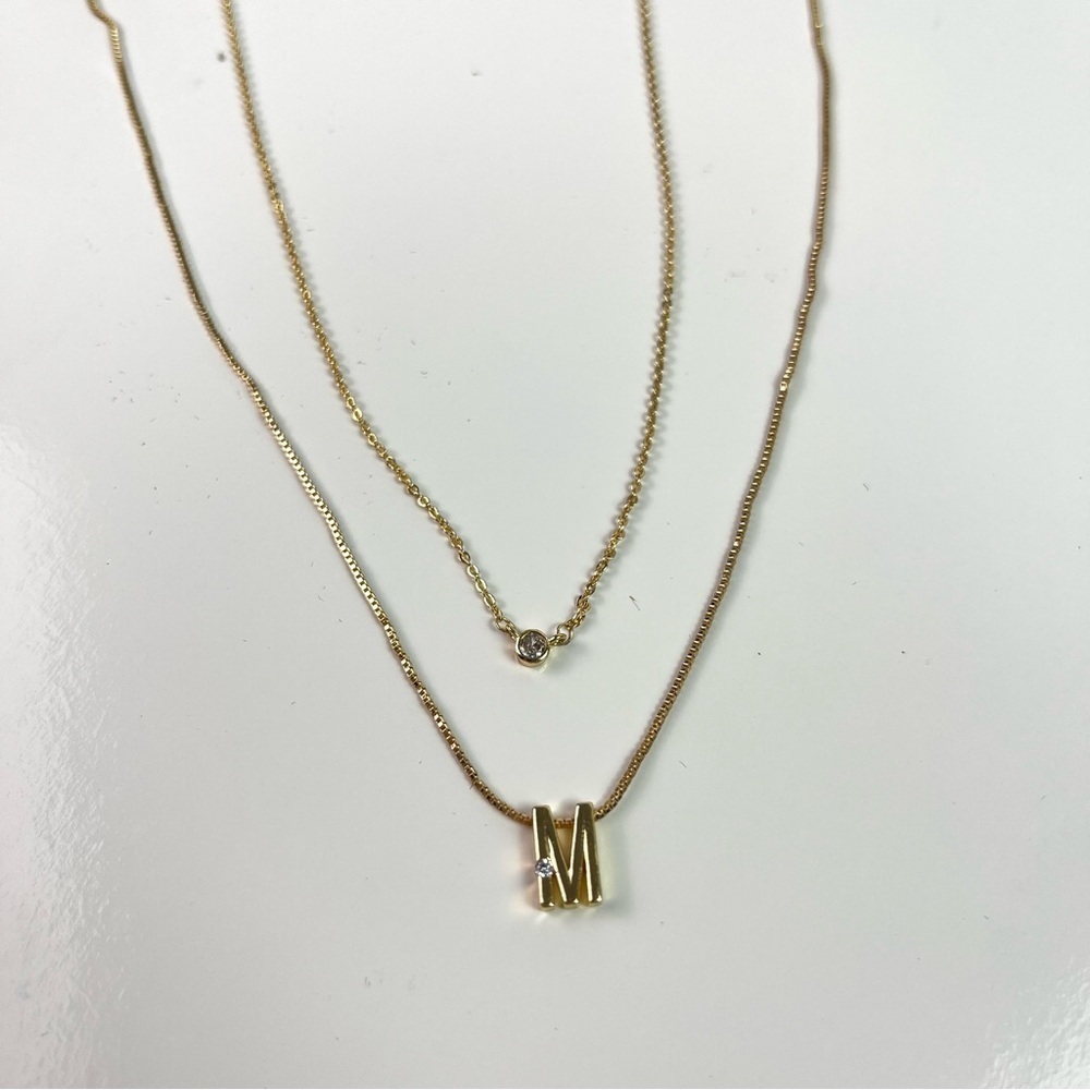 Set of 2 Gold Toned Necklaces Initial “M” and Clear Stone Set